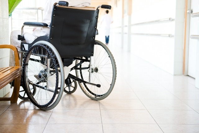 A wheelchair parked on the best flooring for a senior living community
