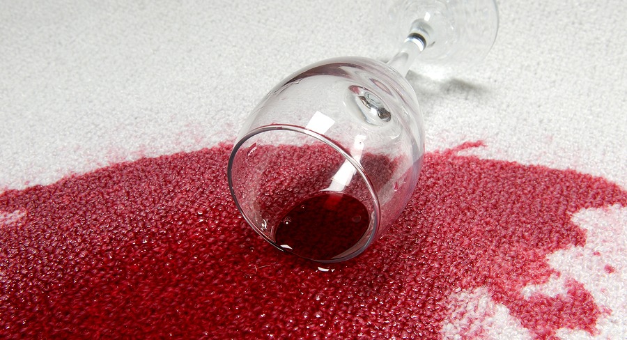 Red wine spilled onto white carpet