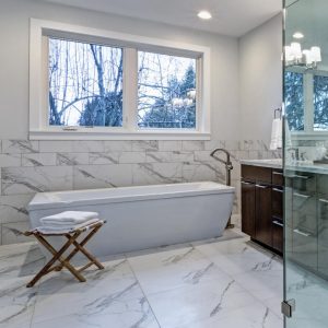 White carrara marble tile in a luxurious hotel-inspired master bathroom