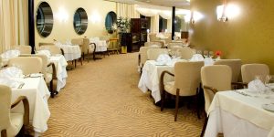 A carpeted dining room in a fine-dining restaurant