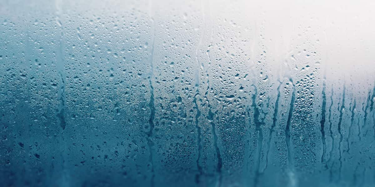 Condensation on a glass surface, illustrating the challenges of high humidity, relevant to selecting the best flooring for humid climate.