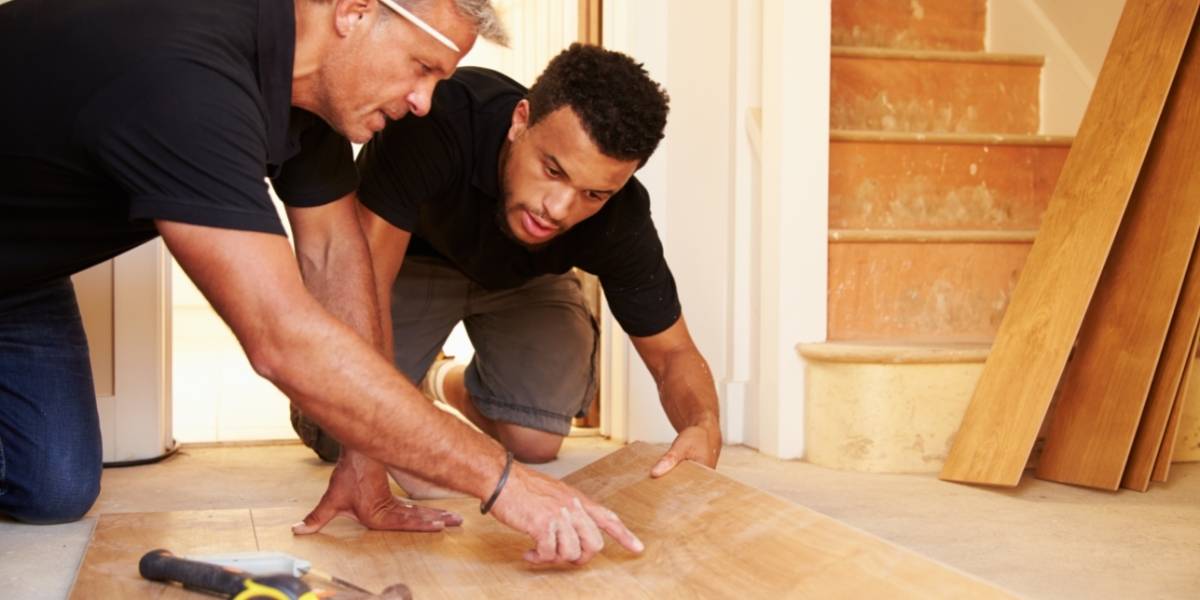 two men installing bella citta floors