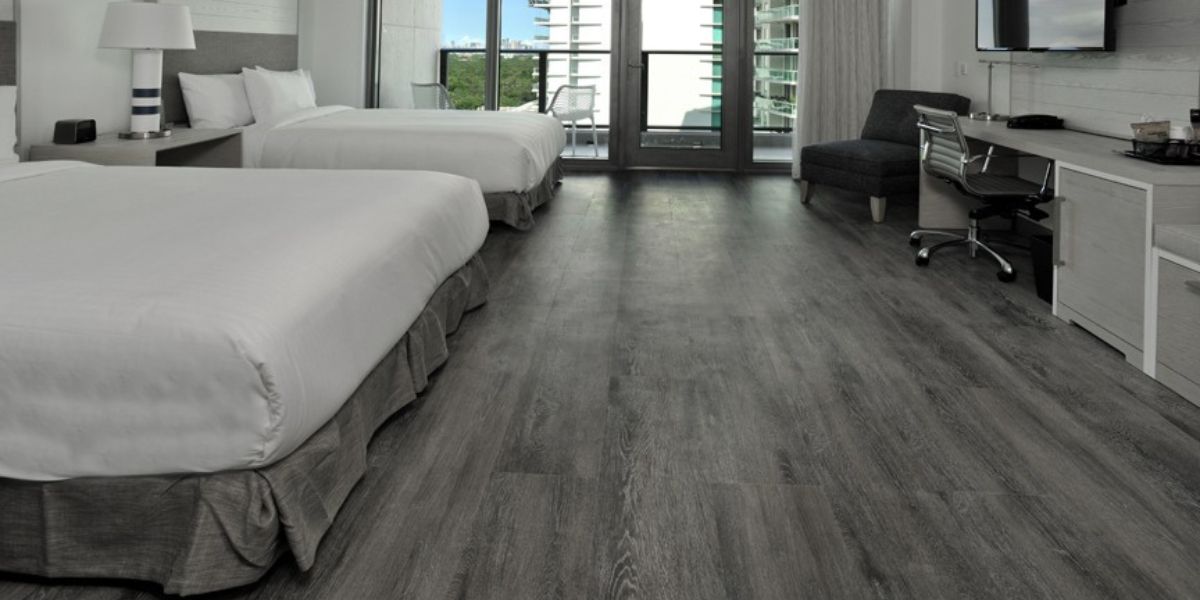 New gray vinyl hospitality flooring is installed in a hotel in South Florida by East Coast Flooring and Interiors.