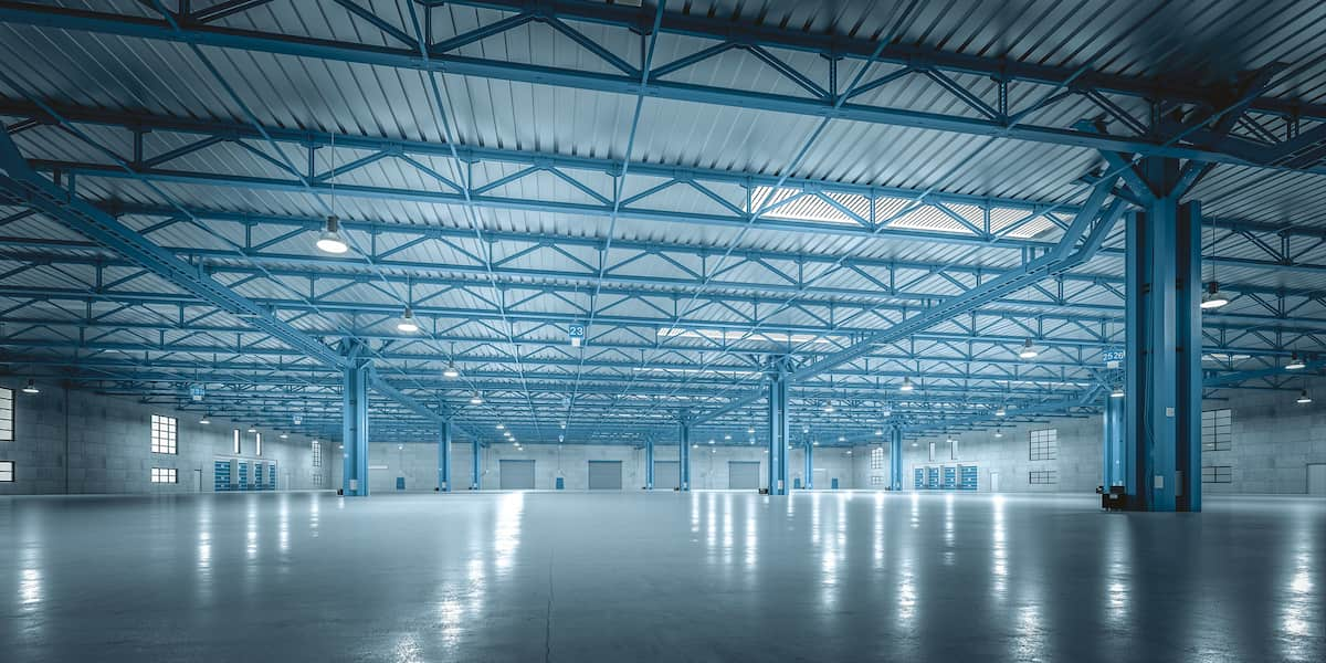 Large industrial space with durable warehouse flooring designed for heavy-duty use and efficient operations.