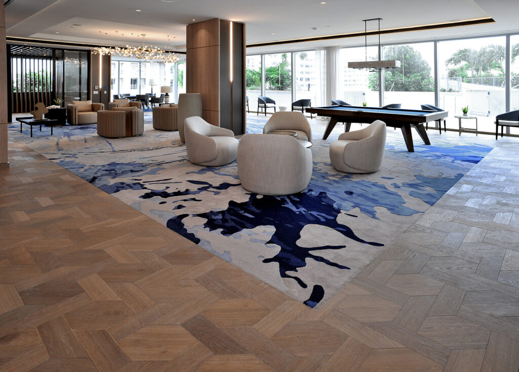 Custom wood flooring and amenity space installation at Selene Fort Lauderdale by East Coast Flooring & Interiors
